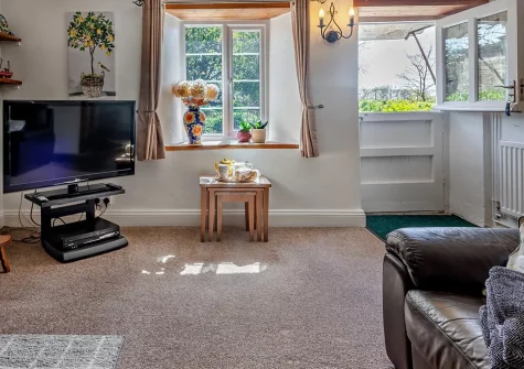 Jobes Cottage, Chapel Amble is a charming 2-bedroom country retreat set in an acre of peaceful grounds with friendly resident animals to visit. Explore Port Isaac, the Eden Project, and Cornwall's stunning coast from this delightful period cottage.