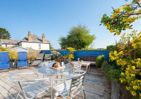 The decked patio, alfresco dining & outdoor sitting area at Joy House, Padstow
