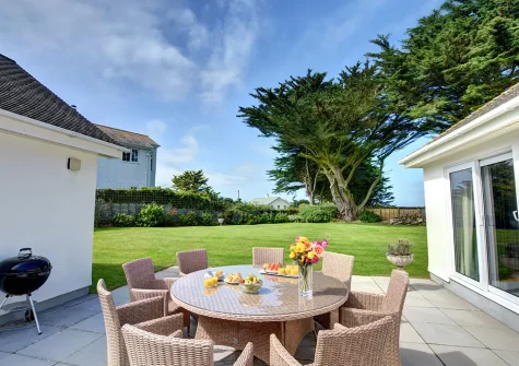 The patio, barbecue, alfresco dining area & garden at Kalundu, Constantine Bay