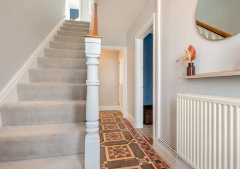The hallway & stairs up to the first floor at Kaolin House, St Austell