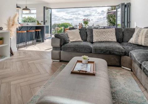 Kaolin House, St Austell is a bright and spacious family home with sea views, featuring a games room, sunny terrace with barbecue, and flexible accommodation for groups, perfectly placed for exploring South Cornwall's beaches and attractions.