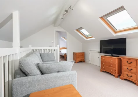 The mezzanine living area at Keepers Lodge, Hillfield Village, Bugford