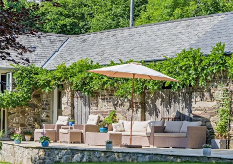 The patio & outdoor sitting area at Kelly Mill Cottage, Lifton