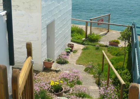 Steps lead down to the private garden & alfresco dining area