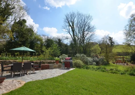 The shared patio, barbecue, alfresco dining area & garden at Kempthornes, Ugborough