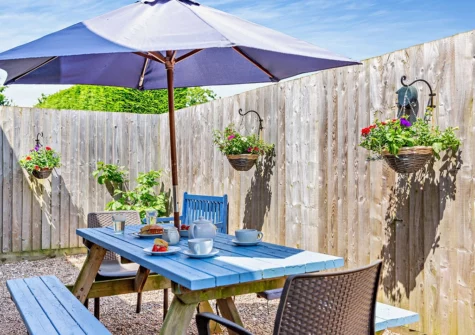 The enclosed courtyard & alfresco dining area at Kenniford Cider Steps, Clyst St George