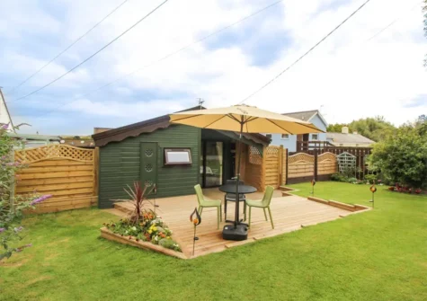 The decked patio, alfresco dining area & garden at Kessenyans Studio, Goonhavern
