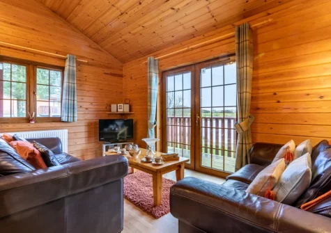 The living area at Kestrel Lodge 15 at Clovelly Lakes, Higher Clovelly