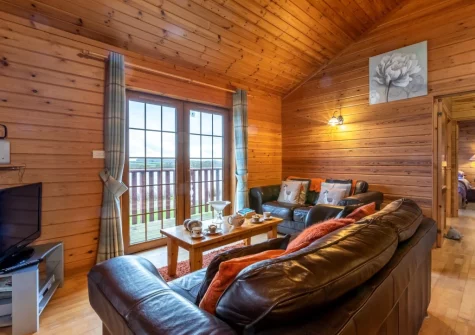 The living area at Kestrel Lodge 15 at Clovelly Lakes, Higher Clovelly