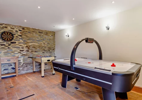 The shared games room at Kingfisher Barn Lakes, St Giles-on-the-Heath