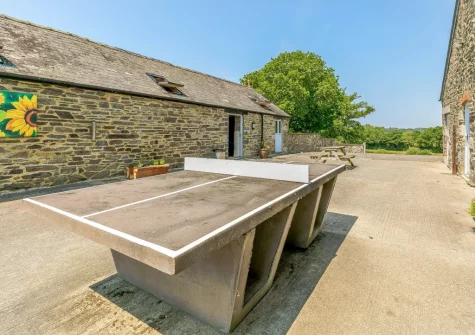 The shared outdoor table tennis at Kingfisher Barn Lakes, St Giles-on-the-Heath