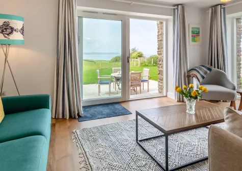 Kingsland Barn, Greencliff Farm, Abbotsham is a stunning three-bedroom coastal retreat with magnificent sea views and direct South West Coast Path access. Perfect for families seeking coastal adventures and countryside tranquillity in North Devon.