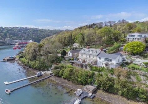 Kits House at Mixtow Creek is a stunning waterside residence with private access to a pontoon, perfect for boating & water sports