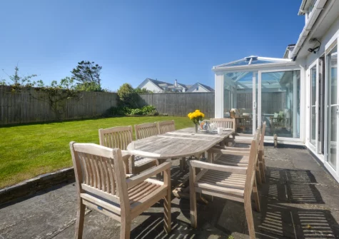 The patio, barbecue, alfresco dining area & enclosed lawned garden at Kittiwake, Constantine Bay
