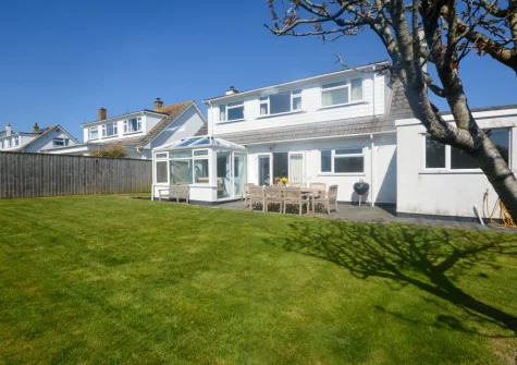The patio, barbecue, alfresco dining area & enclosed lawned garden at Kittiwake, Constantine Bay