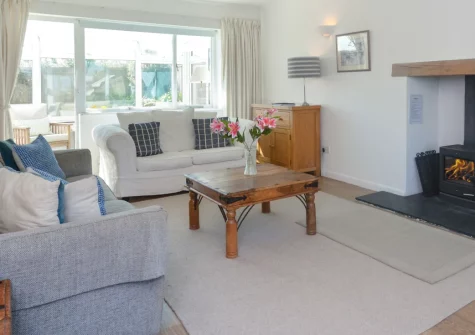 Kittiwake, Constantine Bay is a bright four-bedroom retreat beside Cornwall's stunning north coast, featuring spacious gardens with sunny patio, a cosy wood burner, and easy access to golden sandy beaches and dramatic coastal walks.