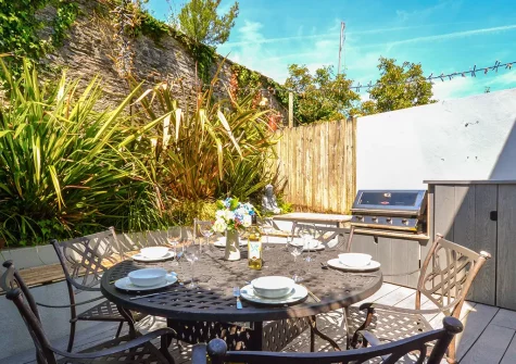 The decked patio, barbecue  & alfresco dining area at Kittiwake, Padstow