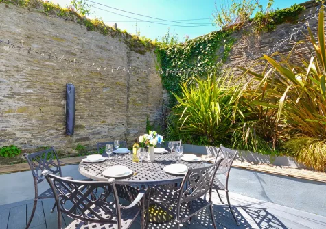 The decked patio, barbecue  & alfresco dining area at Kittiwake, Padstow