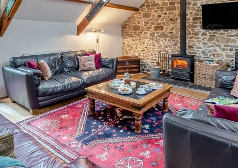 Knaworthy, Frithelstock Stone is a wonderful ten-bedroom barn conversion in 130 acres of woodland. Perfect for family gatherings and friends' reunions, this rural retreat offers games rooms, tennis courts, and boundless outdoor adventures.