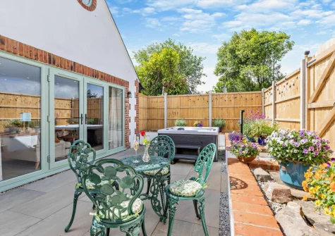 The patio, barbecue, alfresco dining area & hot tub at Kosi Kot, South Molton