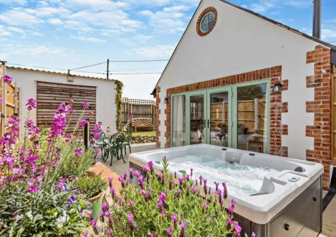 The patio, barbecue, alfresco dining area & hot tub at Kosi Kot, South Molton