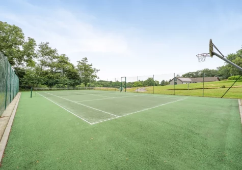 The shared tennis court at Lakeside Haven, Kilkhampton