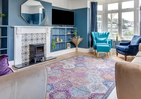 Lamorna, Looe is a captivating four-bedroom house with stunning harbour views and charming character. Enjoy high ceilings, covered terraces, and elegant style perfect for unforgettable family gatherings and truly memorable seaside holidays.