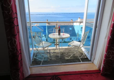 The balcony & outdoor sitting area at Lamorna, Porthleven