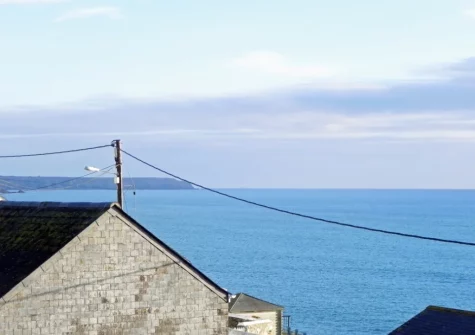 The sea view from the balcony & outdoor sitting area at Lamorna, Porthleven