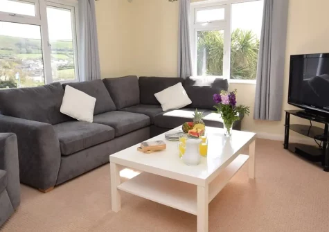 Lane Head, Croyde is a charming detached bungalow sleeping six with stunning ocean views and extensive wraparound gardens. Perfectly positioned near Devon's golden beaches, surf schools, and family attractions for unforgettable seaside holidays.