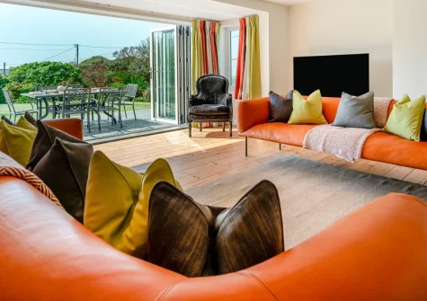 Langarth, Constantine Bay is a superb six-bedroom family house with sea views from all first-floor rooms, contemporary interiors, direct beach access via the garden gate, and just moments from Constantine Bay's stunning sandy shores.