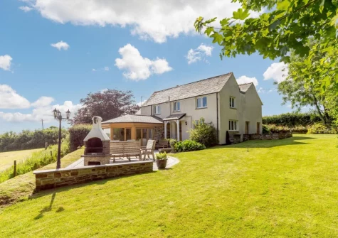 The patio, barbecue, alfresco dining area & large enclosed garden at Langdon House, Jacobstow