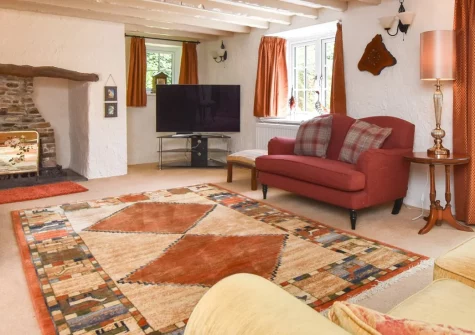 Langdon House, Jacobstow is a spacious four-bedroom detached retreat in peaceful North Cornwall countryside, featuring exposed beams, open fireplaces, and a large garden with country views, perfectly placed for beaches and coastal exploration.