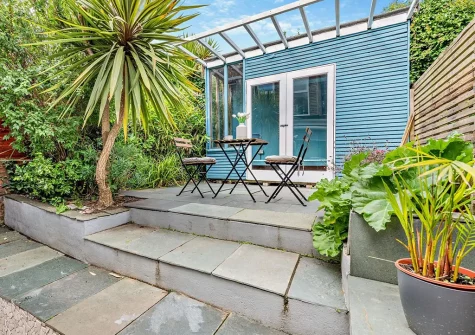 The enclosed courtyard, outdoor sitting area & summer house at Langs House, Paignton