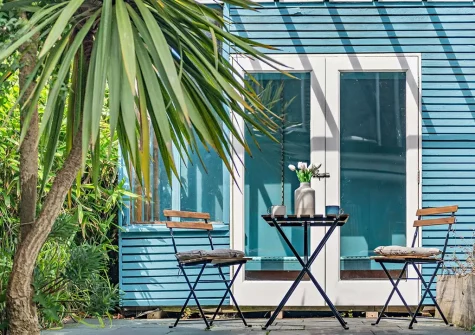 The enclosed courtyard, outdoor sitting area & summer house at Langs House, Paignton