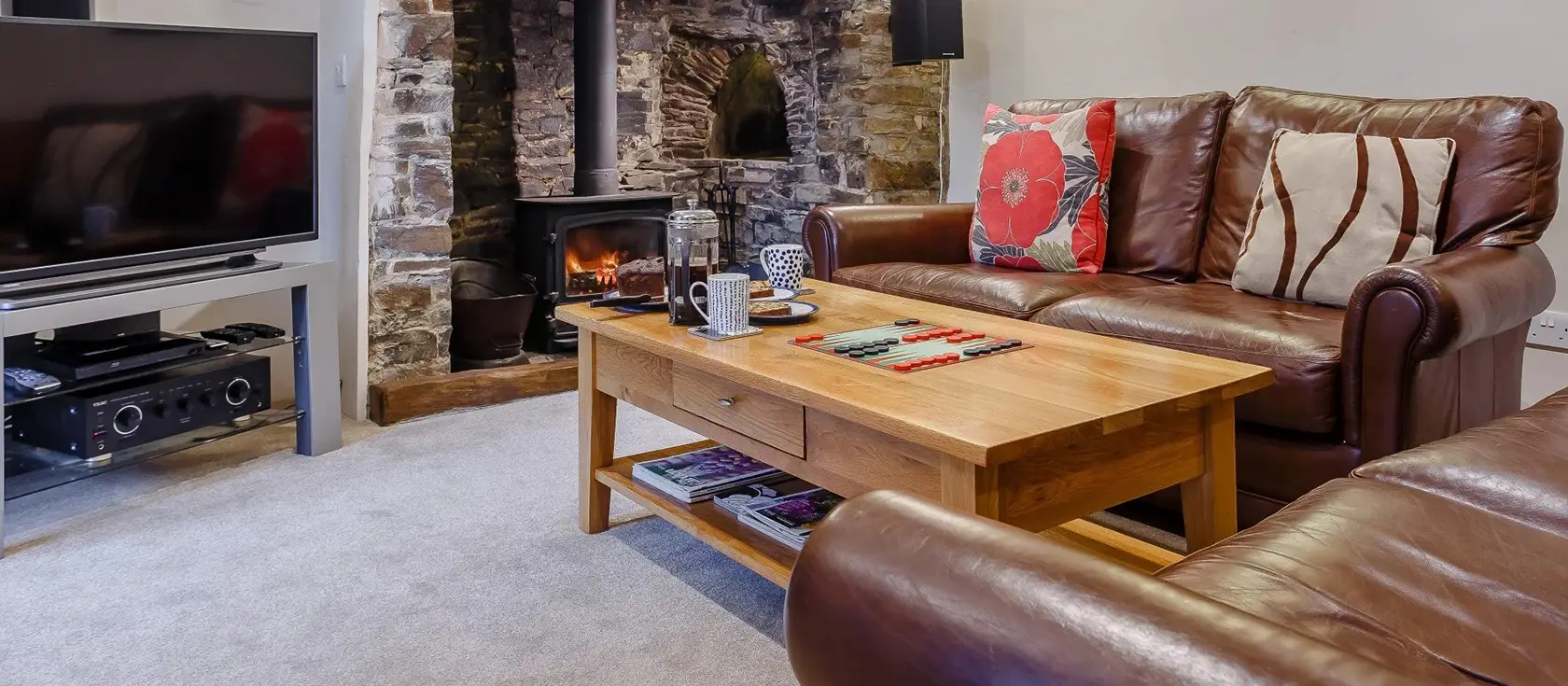 Lantern Cross Cottage, Beaford is a charming four-bedroom retreat with original inglenook fireplaces, exposed beams, and two acres of private enclosed grounds. Perfectly positioned for families exploring North Devon's stunning beaches & attractions.