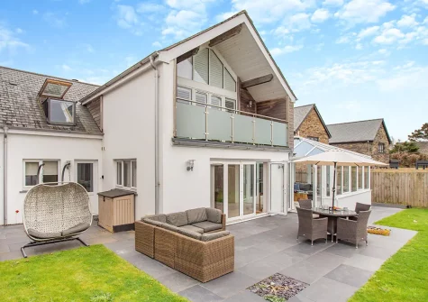 The patio, alfresco dining area & garden at Lanveans, Bude