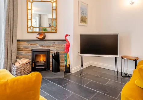 Lawn Cottage, Padstow is a contemporary 3-bedroom retreat with vibrant interiors and artistic touches. Enjoy a private sun-trap patio, luxurious en-suites, and easy access to harbour dining and stunning Cornish beaches perfect for families.