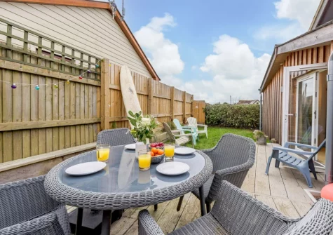 The decked patio, alfresco dining, outdoor sitting area & garden at Leadengate Fields, Croyde