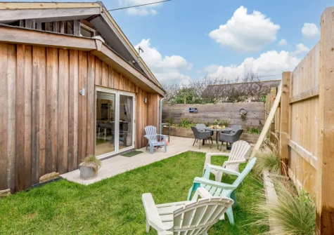 The decked patio, alfresco dining, outdoor sitting area & garden at Leadengate Fields, Croyde