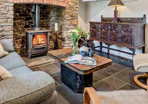 Leaferne, Marhamchurch is a stunning four-bedroom retreat blending contemporary luxury with period charm, featuring a warming wood burner, spacious dual-level garden, and flexible sleeping arrangements, just moments from Bude's golden beaches.