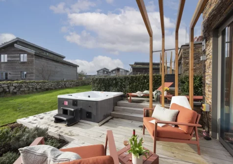 The patio, outdoor sitting area & hot tub at Lefransa at Una, St Ives