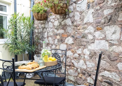 The enclosed courtyard garden & alfresco dining area at Lilly's Cottage, Dawlish