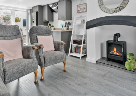 Lilly's Cottage, Dawlish is a stylish three-storey retreat sleeping seven guests, just moments from the seafront, featuring a sunny enclosed courtyard garden, three tasteful bedrooms, and easy access to the beach, shops and coastal path.