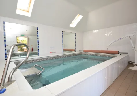 The shared heated indoor endless pool & sauna at South Torfrey Farm, Golant