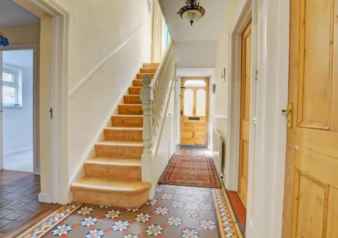 The entrance hallway & stairs up to the first floor at Lindos, Looe