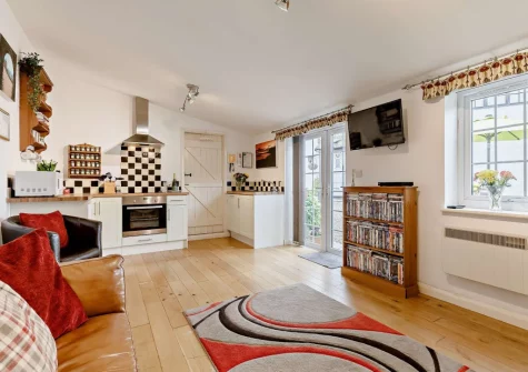 The living area & kitchen at Little Beau, Ottery St Mary