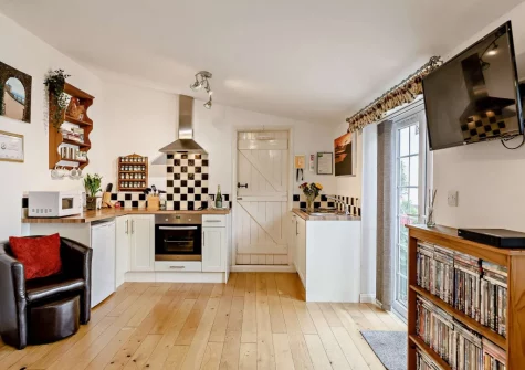 The living area & kitchen at Little Beau, Ottery St Mary