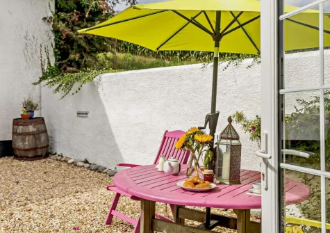 The enclosed courtyard & alfresco dining area at Little Beau, Ottery St Mary