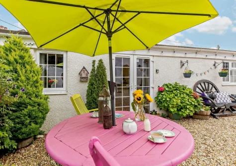 The enclosed courtyard, alfresco dining & outdoor sitting area at Little Beau, Ottery St Mary